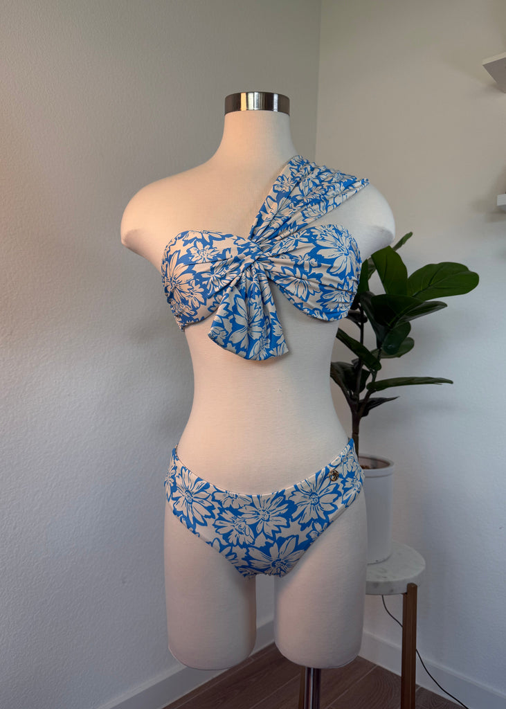 Mannequin wearing a blue and white floral bikini